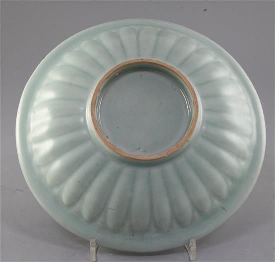 A Chinese celadon glazed twin fish dish, Song dynasty style, 25cm